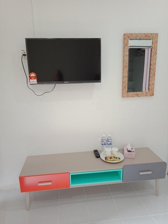 TV a/nebo společenská místnost v ubytování D lima beach inn