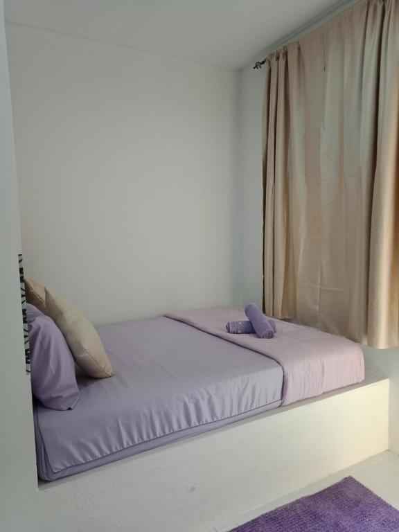 Postel nebo postele na pokoji v ubytování D lima beach inn