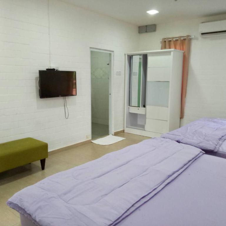 Postel nebo postele na pokoji v ubytování D lima beach inn
