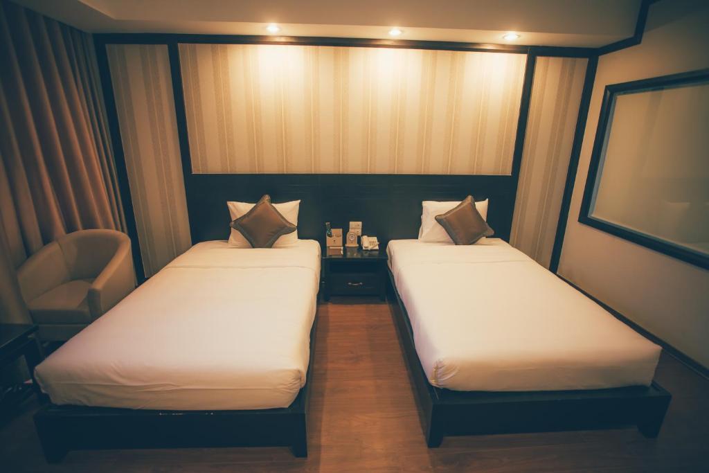 Postel nebo postele na pokoji v ubytování Friendship hotel