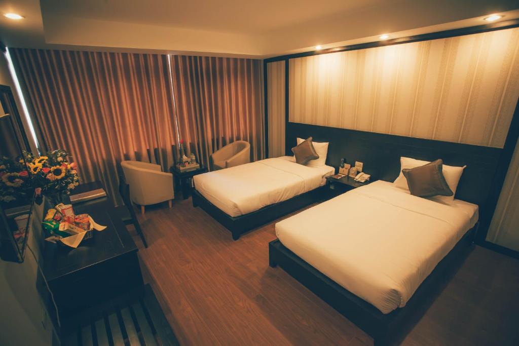 Postel nebo postele na pokoji v ubytování Friendship hotel