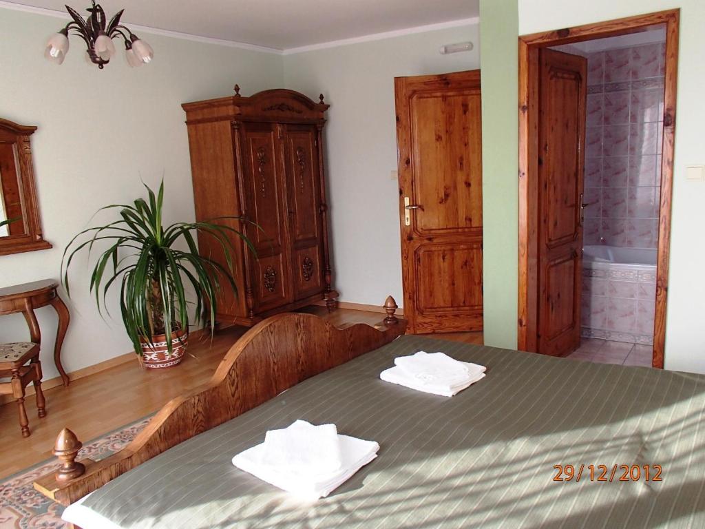 Postel nebo postele na pokoji v ubytování Pension Magnolia
