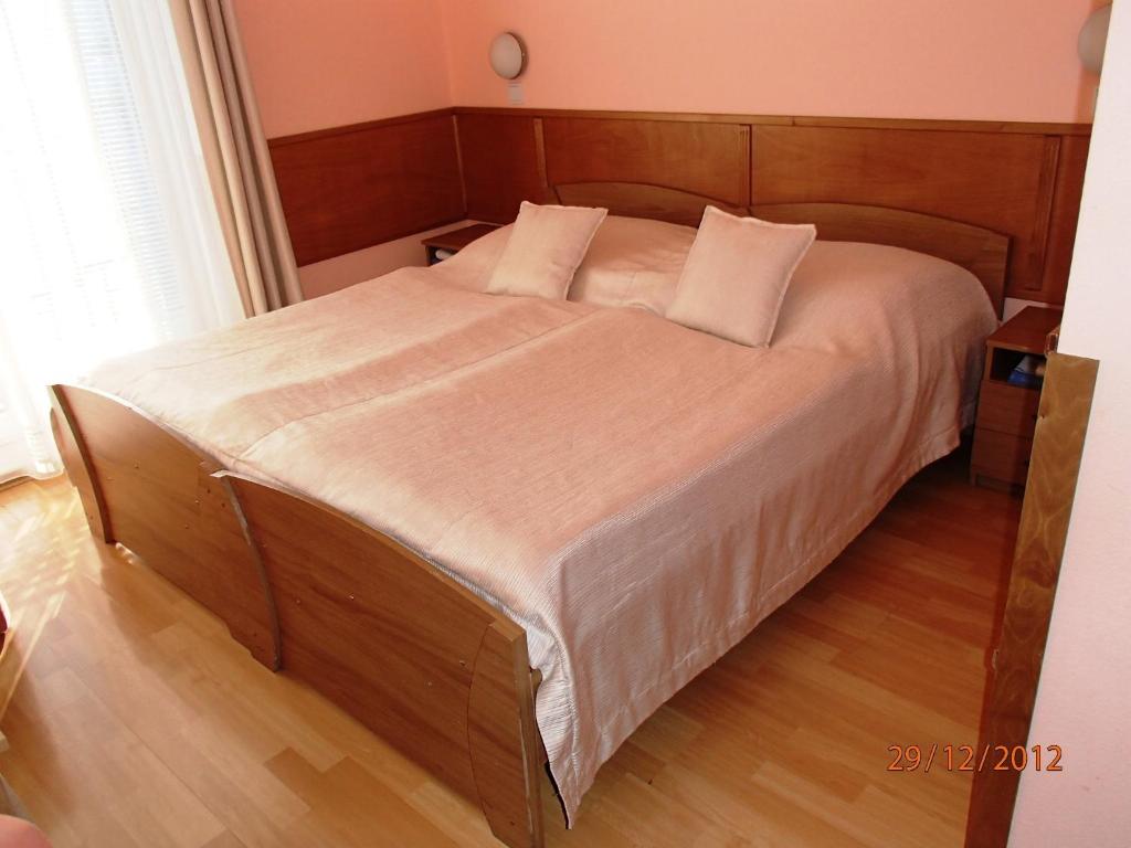 Postel nebo postele na pokoji v ubytování Pension Magnolia