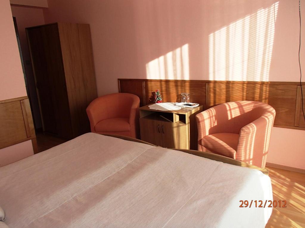 Postel nebo postele na pokoji v ubytování Pension Magnolia