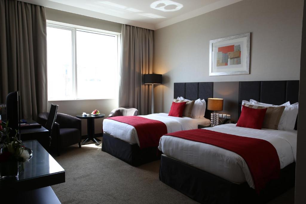 Cama o camas de una habitación en Ramada Downtown Abu Dhabi