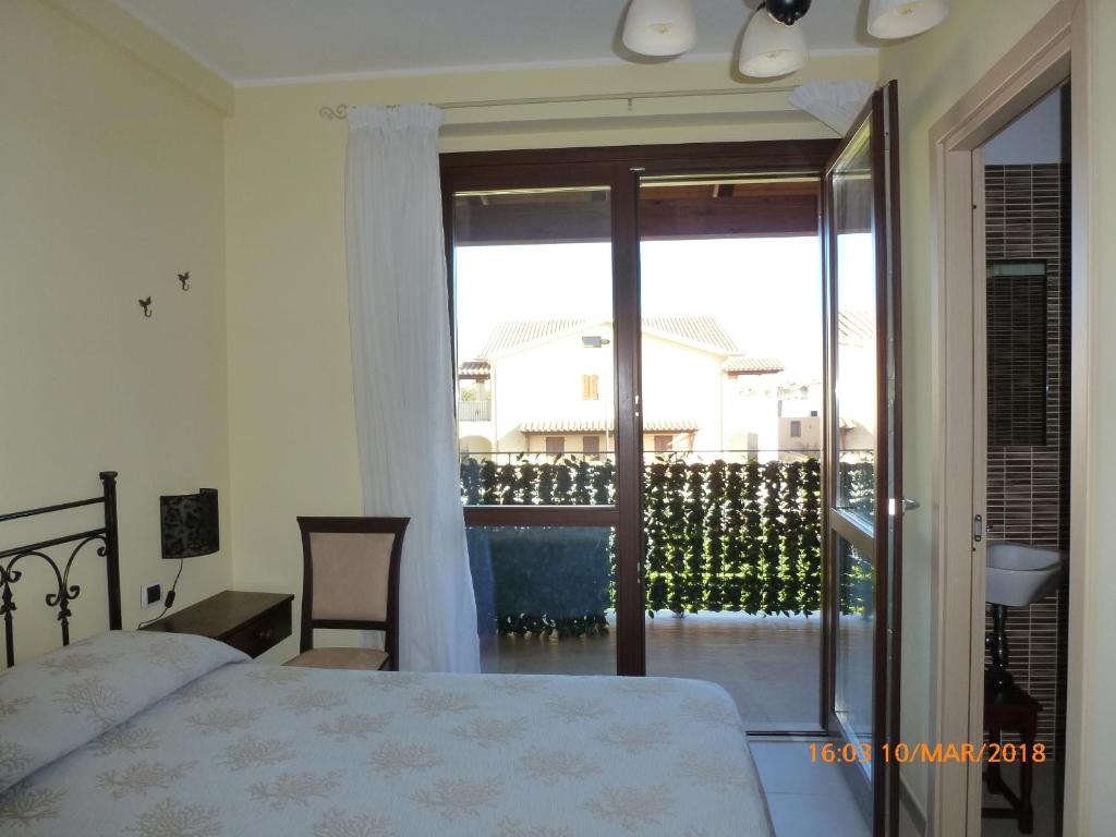 Łóżko lub łóżka w pokoju w obiekcie Sogno di mare