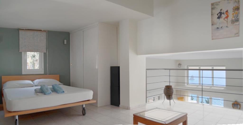 Postel nebo postele na pokoji v ubytování Villa Alibertini
