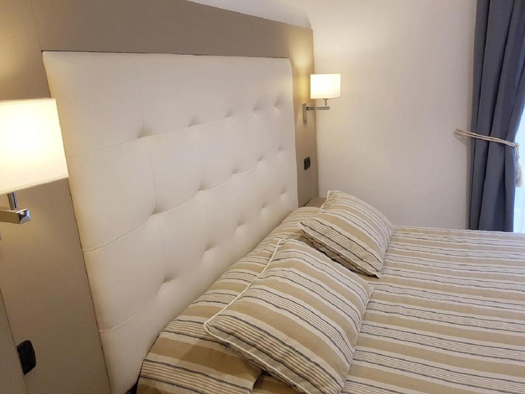 Postel nebo postele na pokoji v ubytování Albergo Degli Amici