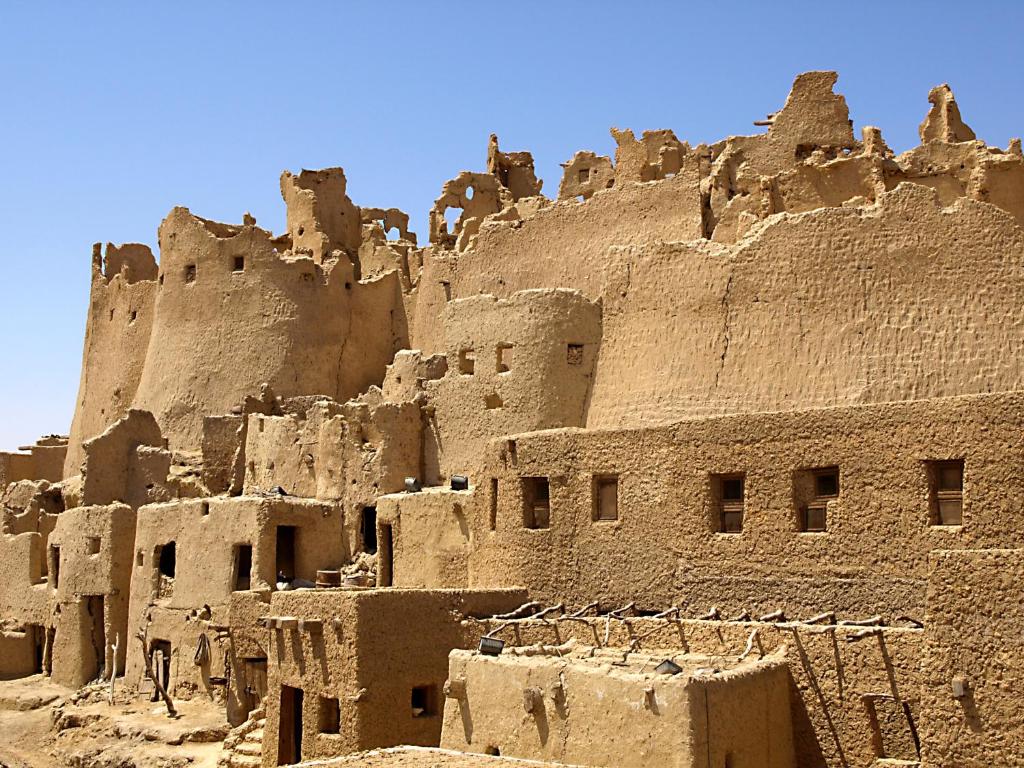 ancient ruins of a building in the desert at Albabenshal Lodge Siwa in Siwa