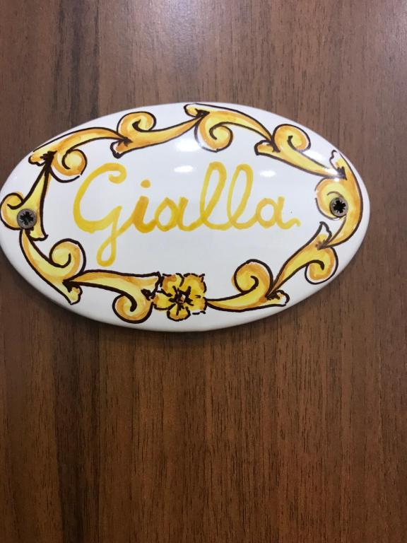a plate with the word gelula on a table at La Casa Di Fafa in Naples