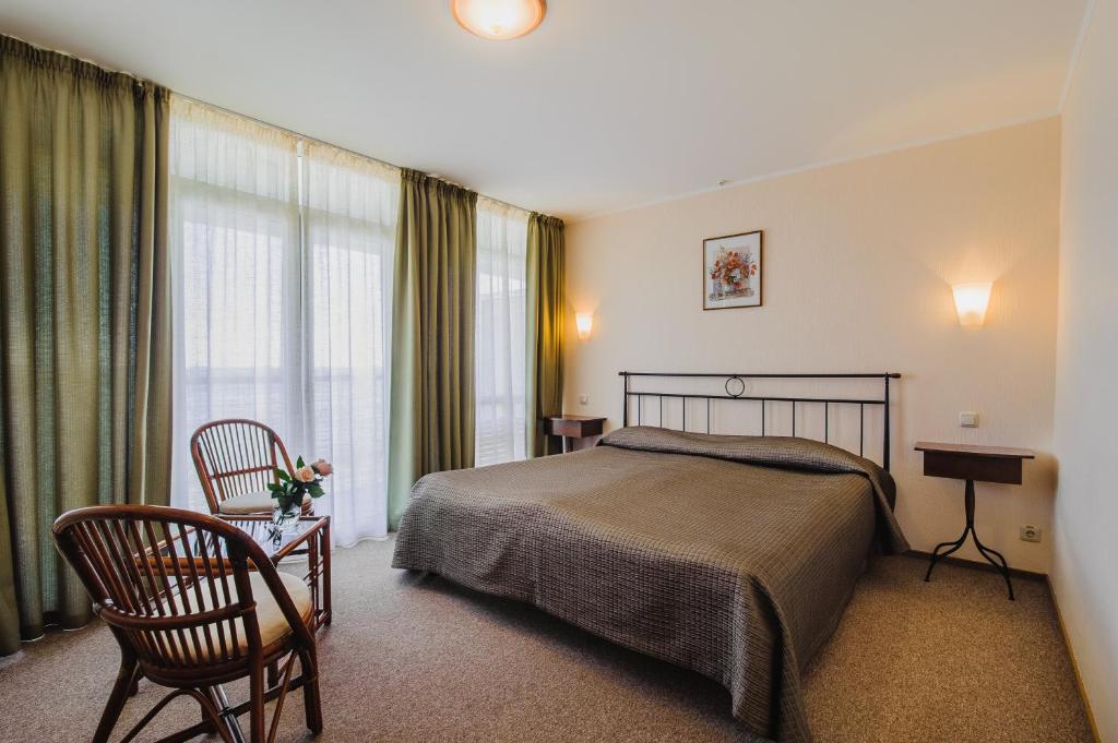 Кровать или кровати в номере Эко Отель Левант