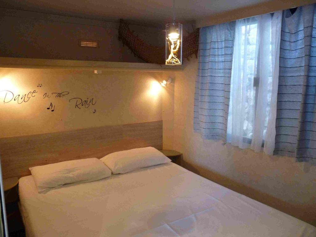 Postel nebo postele na pokoji v ubytování Camping Aloa
