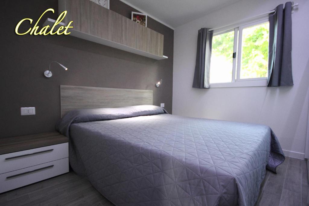 Postel nebo postele na pokoji v ubytování Camping Santin