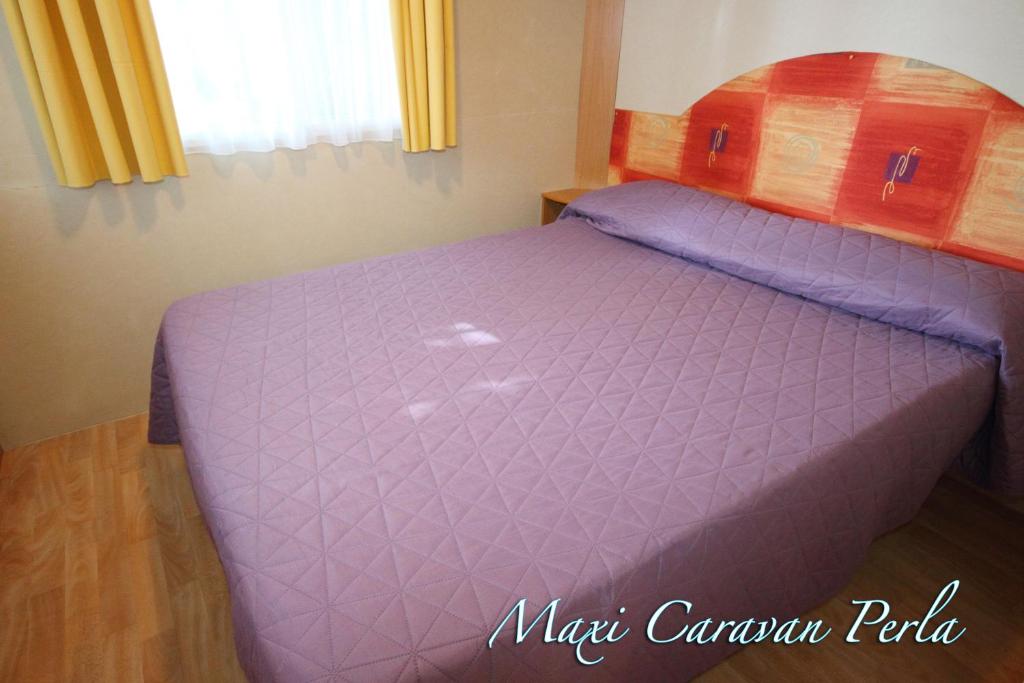 Postel nebo postele na pokoji v ubytování Camping Santin