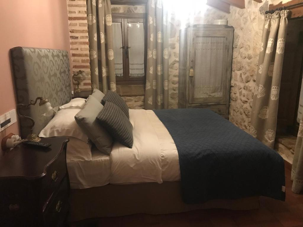 Postel nebo postele na pokoji v ubytování El Corral De Perorrubio