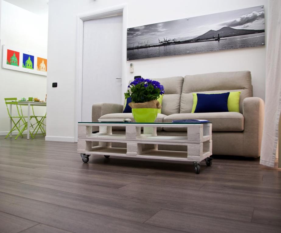 a living room with a couch and a coffee table at Scugnizzo Apartment in Naples