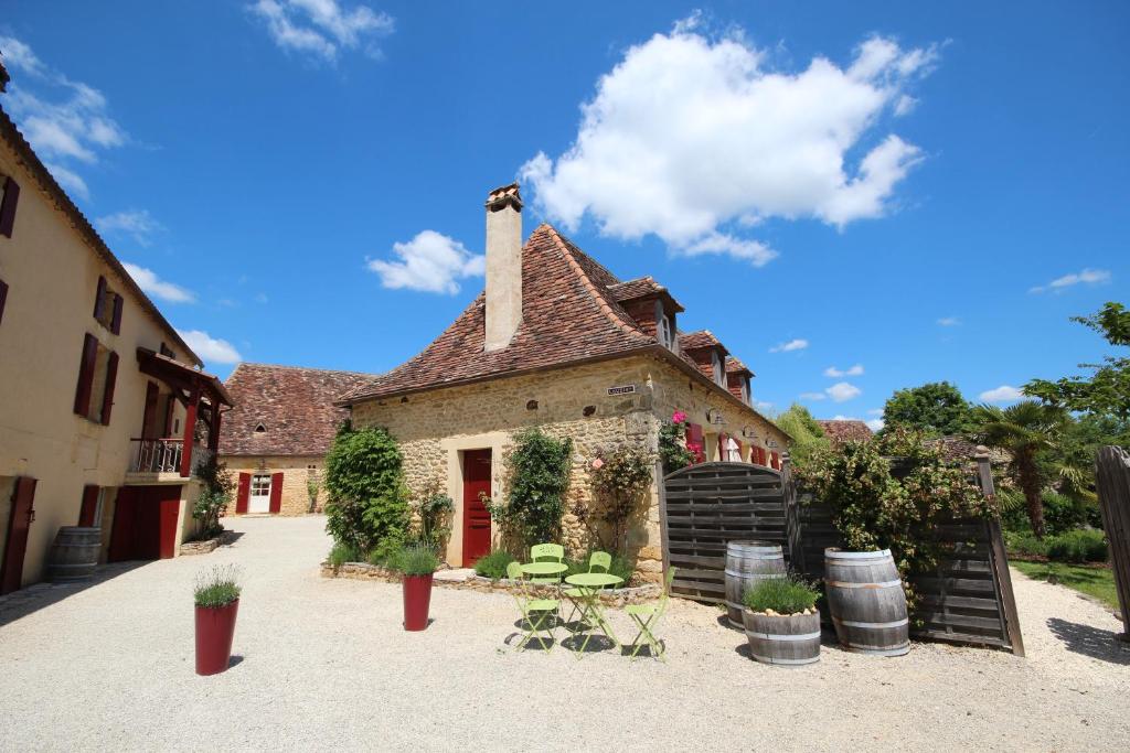 an old building with plants in front of it at Le Domaine des Fargues in Sainte-Foy-de-Longas