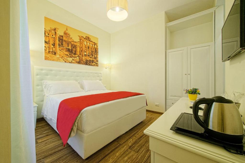 Łóżko lub łóżka w pokoju w obiekcie Star Vatican Rooms