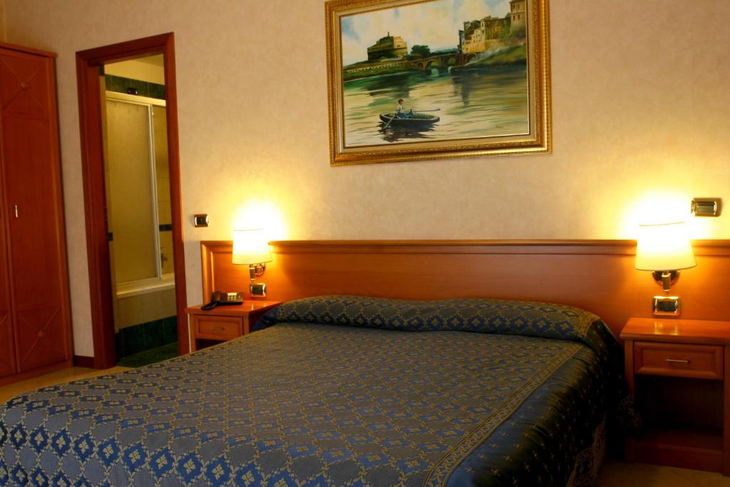 Postel nebo postele na pokoji v ubytování Hotel Orlanda