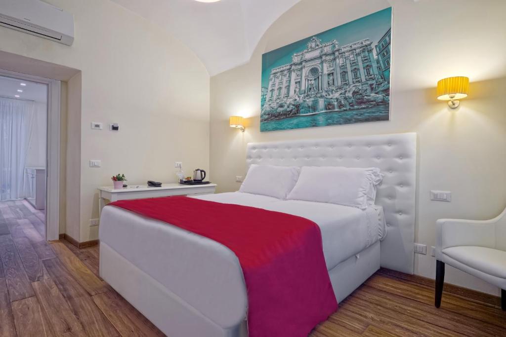 Łóżko lub łóżka w pokoju w obiekcie Star Vatican Rooms