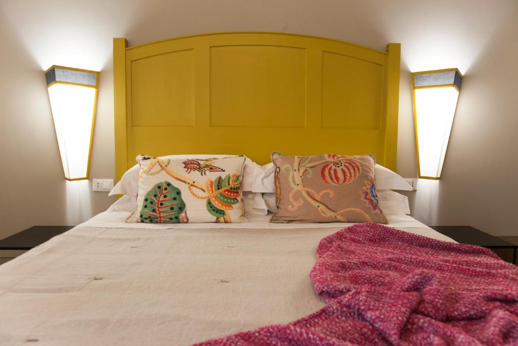 Posteľ alebo postele v izbe v ubytovaní Casa Fabbrini Fancy Suites