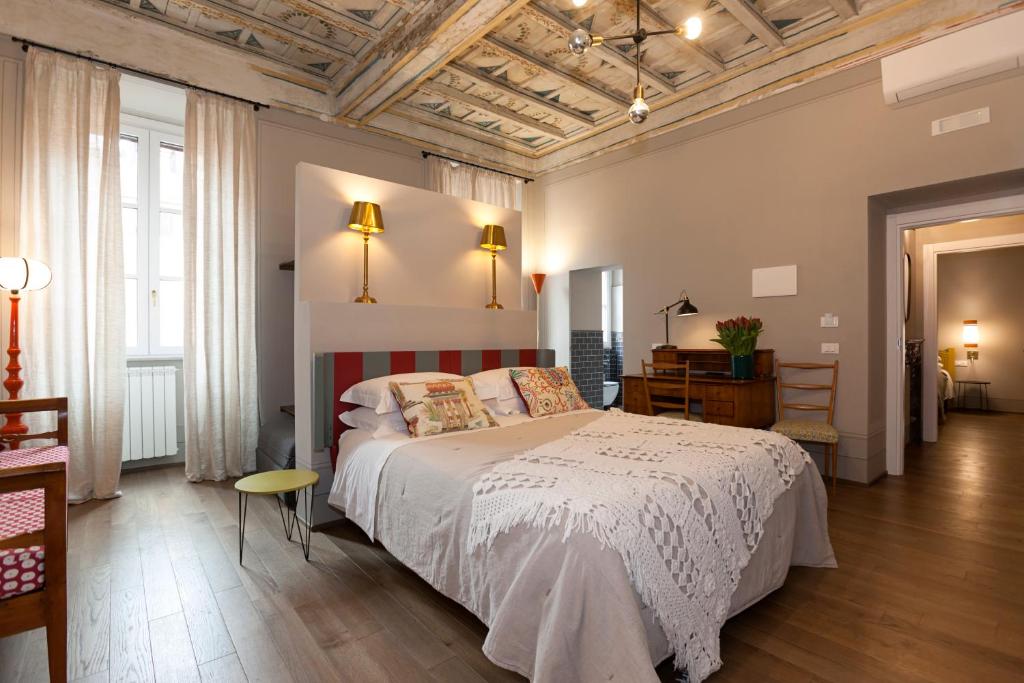 Posteľ alebo postele v izbe v ubytovaní Casa Fabbrini Fancy Suites