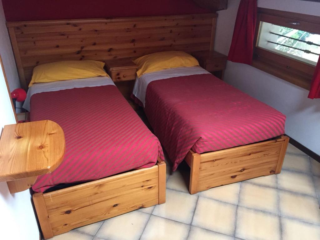 Voodi või voodid majutusasutuse Hotel Carrara toas