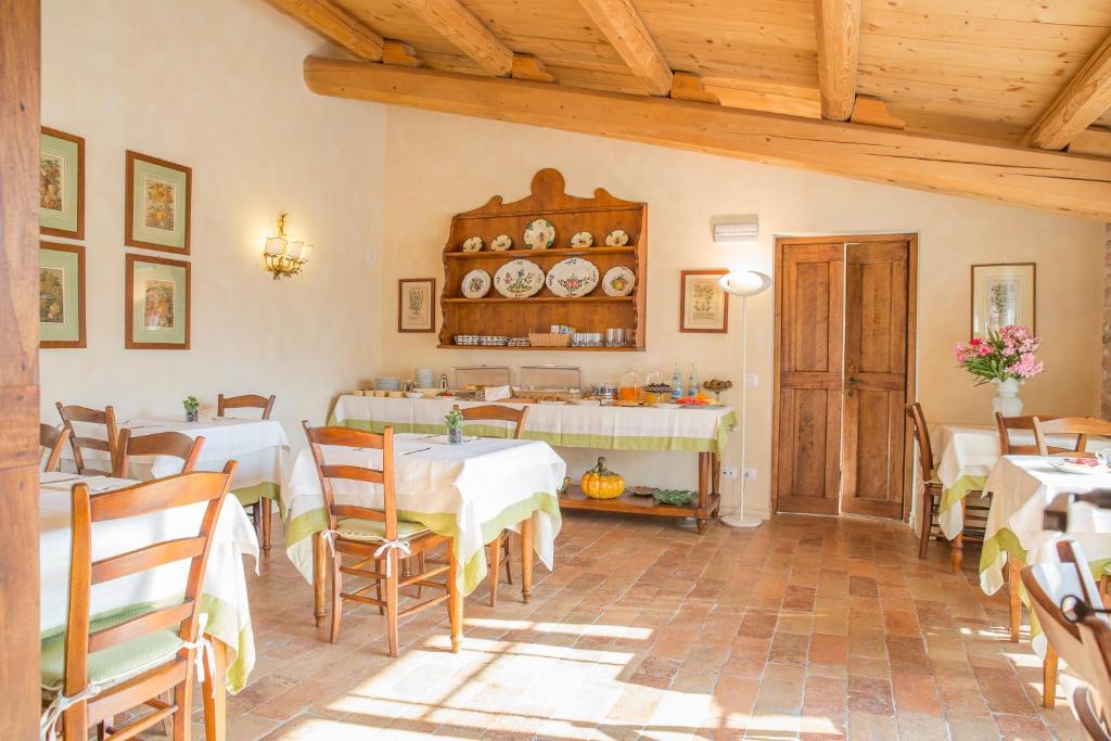 Reštaurácia alebo iné gastronomické zariadenie v ubytovaní Antico Casale Bergamini