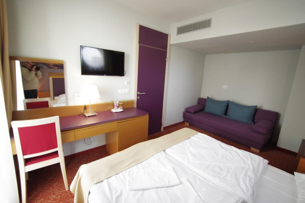 Postel nebo postele na pokoji v ubytování Szent Gellért Hotel