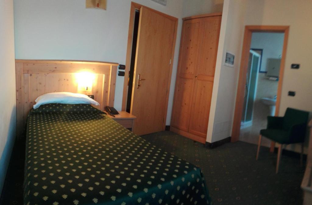 Postel nebo postele na pokoji v ubytování Hotel Dall'Ongaro