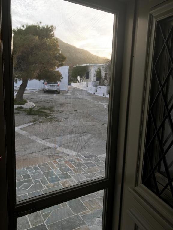 a view from a window of a parking lot at Spitaki Serifos Studio in Rámos