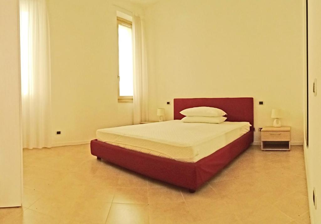 Posteľ alebo postele v izbe v ubytovaní Campione Ora apartments by Gardadomusmea