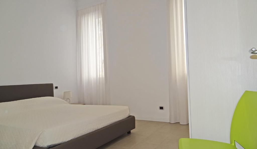 Posteľ alebo postele v izbe v ubytovaní Campione Ora apartments by Gardadomusmea
