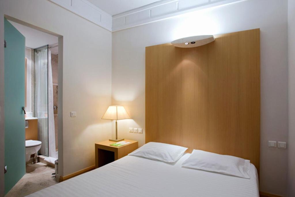 Postel nebo postele na pokoji v ubytování Central Hotel