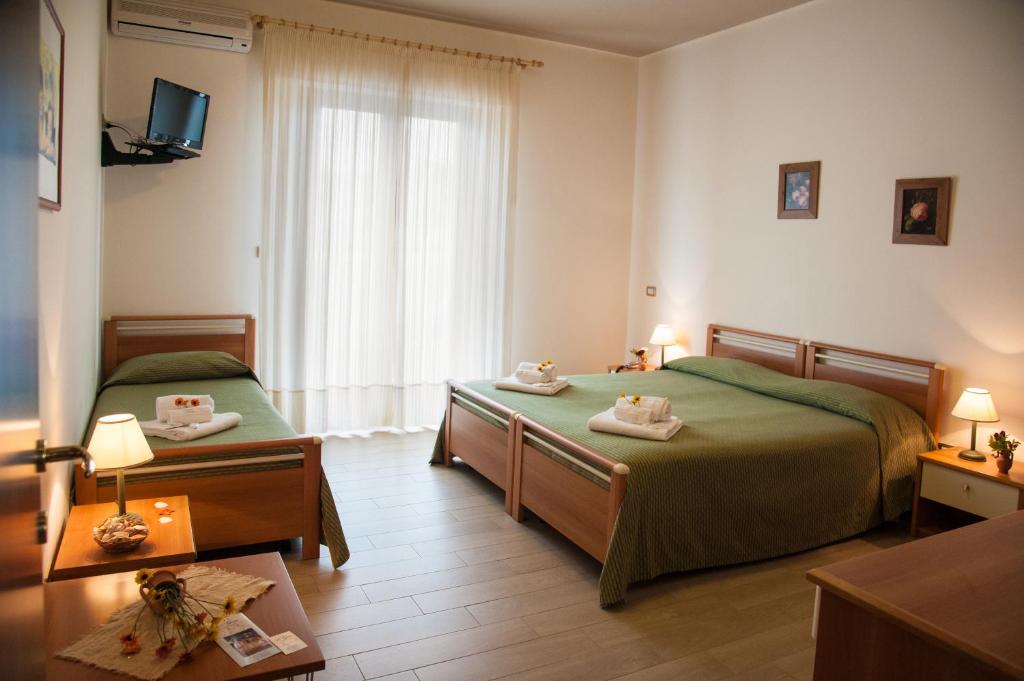 Posteľ alebo postele v izbe v ubytovaní Le Giare B&B