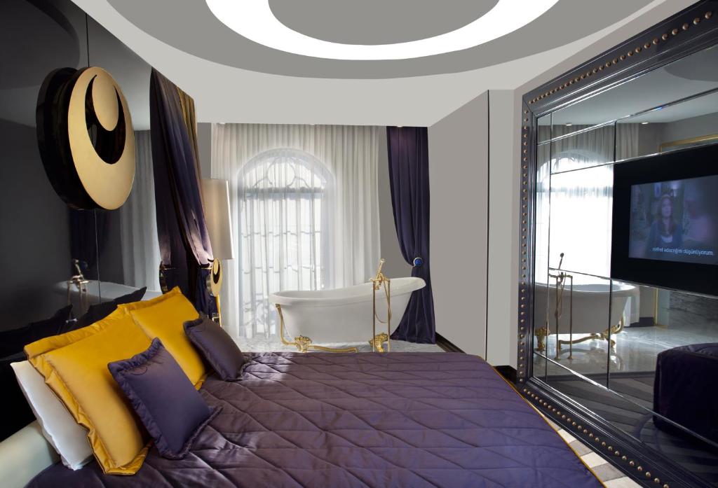 A bed or beds in a room at Sura Design Hotel & Suites