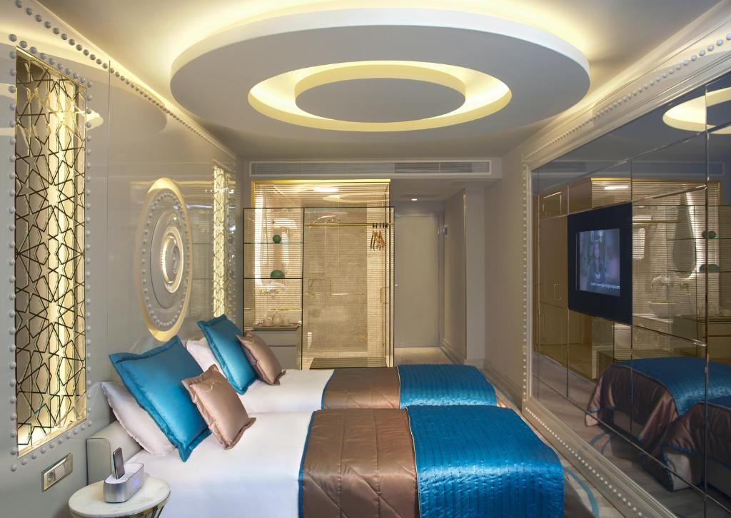 A bed or beds in a room at Sura Design Hotel & Suites