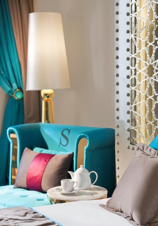 A bed or beds in a room at Sura Design Hotel & Suites