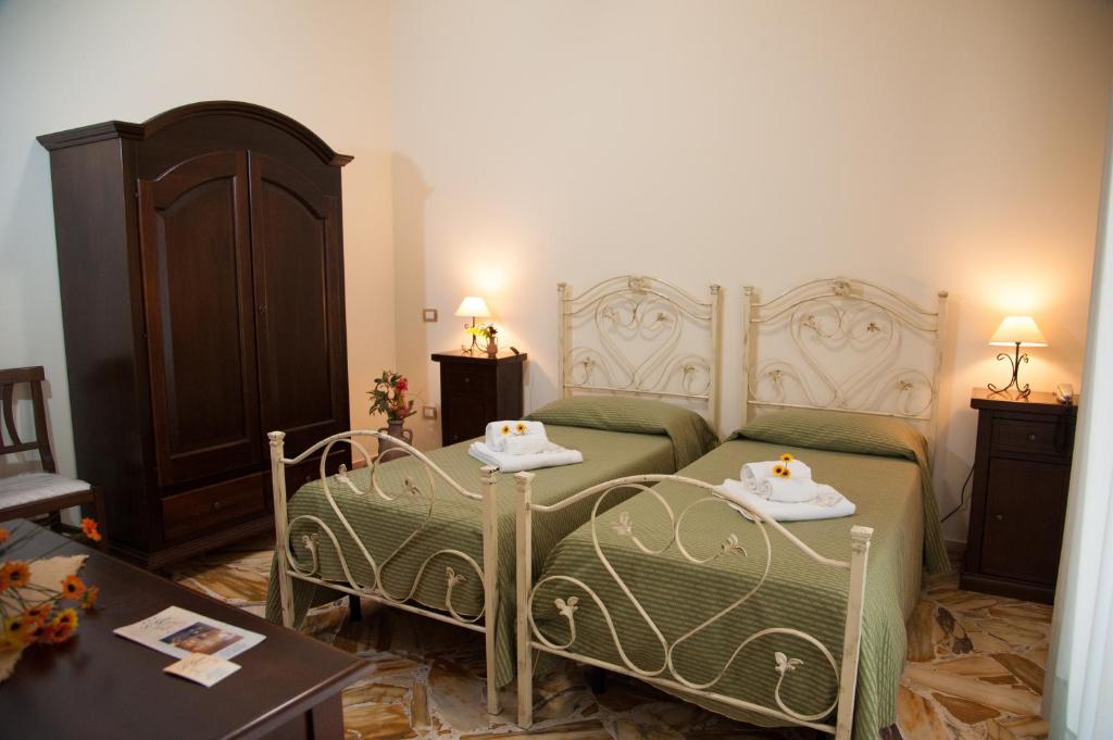 Posteľ alebo postele v izbe v ubytovaní Le Giare B&B