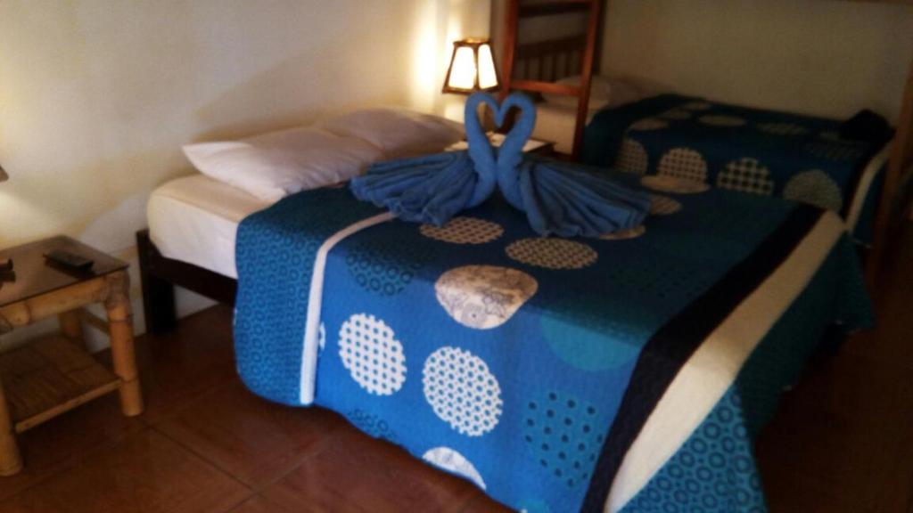 Postel nebo postele na pokoji v ubytování Las Tortuguitas Bungalows