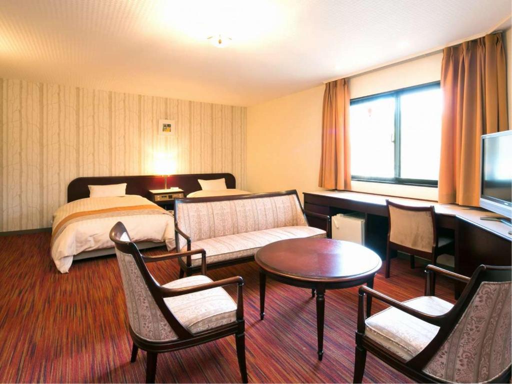 Postel nebo postele na pokoji v ubytování Azumino Hotaka View Hotel