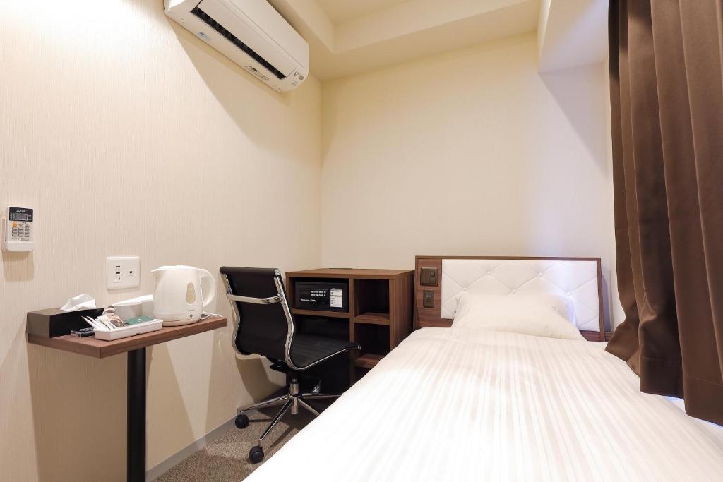 Postel nebo postele na pokoji v ubytování Welina Hotel Dotonbori