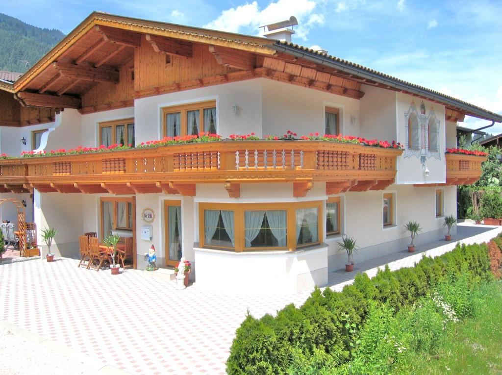 a large house with a balcony on top of it at Deluxe Apartment Sonnseite in Aschau