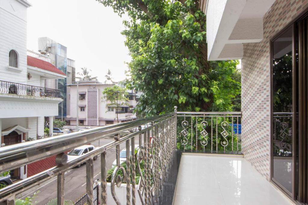 a balcony with a view of a street at Comfortable Living in Navi Mumbai