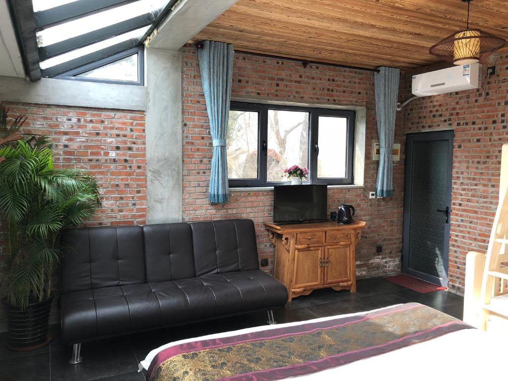 TV o dispositivi per l'intrattenimento presso Beijing Mutianyu Great Wall Wangshanyuan Homestay
