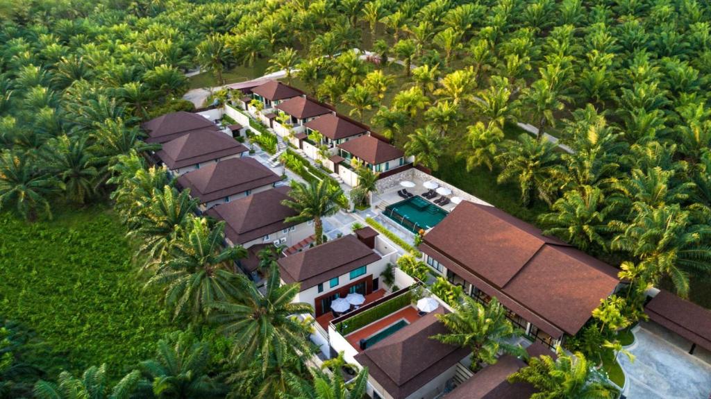 an overhead view of a resort with palm trees at De Malee Pool Villas - SHA Extra Plus in Ao Nang Beach