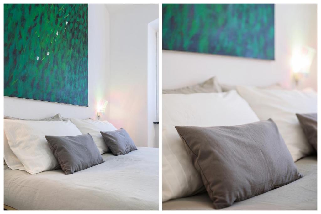 A bed or beds in a room at Portofino Dream Flexyrent NO air conditioning