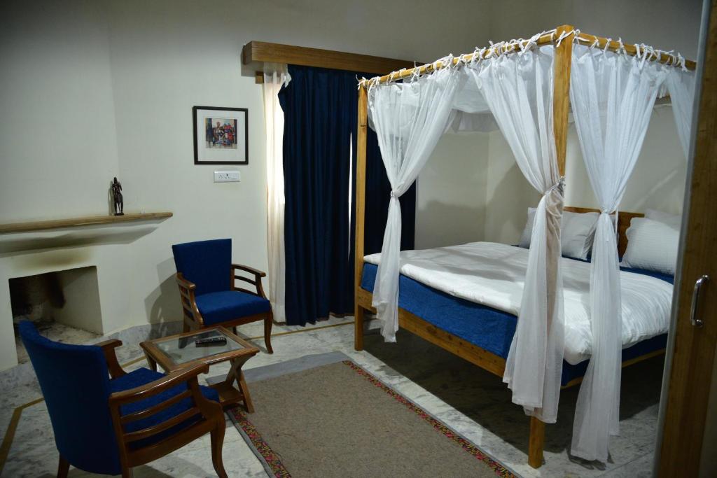 Postel nebo postele na pokoji v ubytování Deodar Homestay