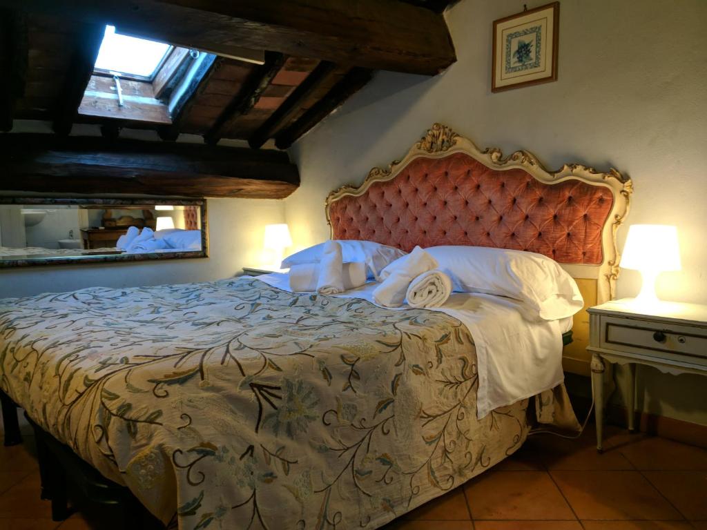 Postel nebo postele na pokoji v ubytování Al Tuscany