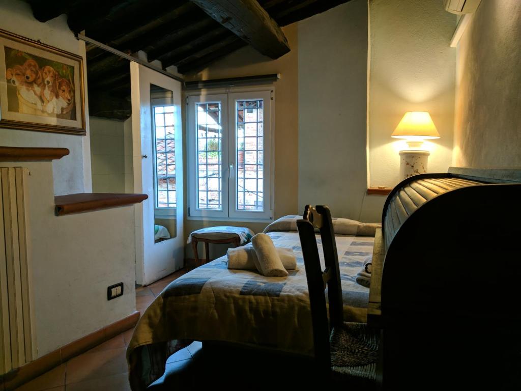 Postel nebo postele na pokoji v ubytování Al Tuscany